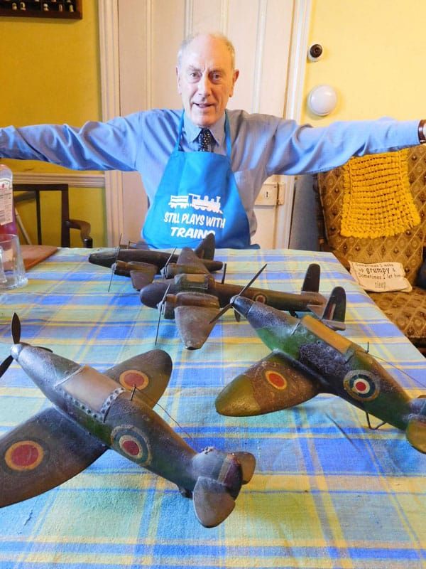 Keith Lucas with warplanes made by his father Thomas